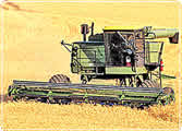 A modern tractor ploughing a large field
