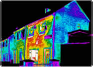 An infrared image of a house showing heat loss.